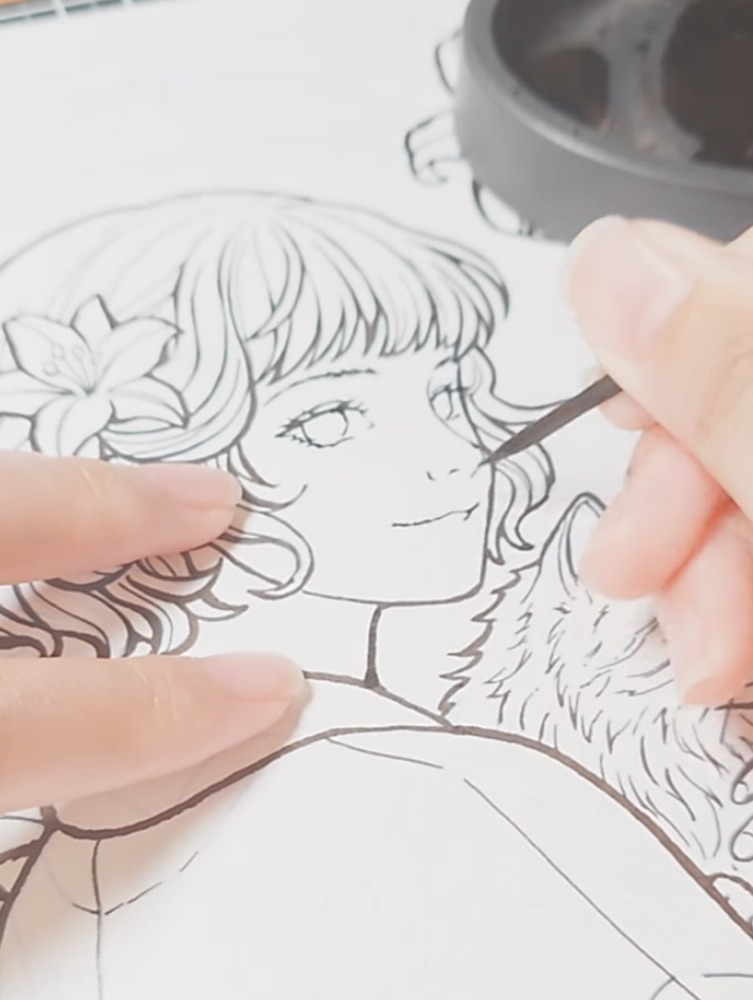 Inking a page by hand with a toothpick